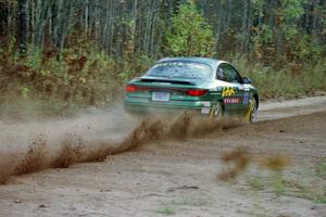 Tad Ohtake / Bob Martin drift their Ford Escort ZX2 through the first corner of Menge Creek I.