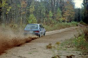 Mark Utecht / Paul Schwerin throw gravel in their Dodge Omni GLH-Turbo near the start of Menge Creek I.