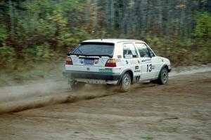 Wayne Prochaska / Annette Prochaska bring their VW Golf through the first corner of Menge Creek I.