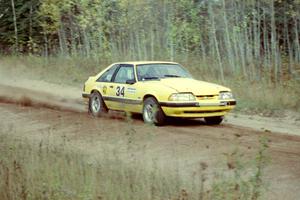 Don Rathgeber / Russ Rathgeber accelerate their Ford Mustang through the first sweeper of Menge Creek I.