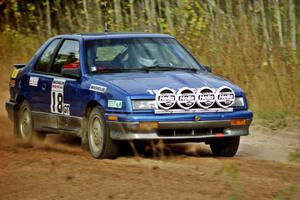 Kendall Russell / Catherine Roso drive their Dodge Shadow away from the start of Menge Creek I.