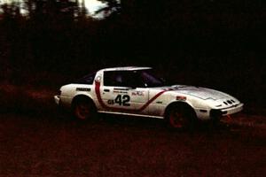 Craig Kazmierczak / Diane Sargent drift their Mazda RX-7 through the first corner of Menge Creek I.