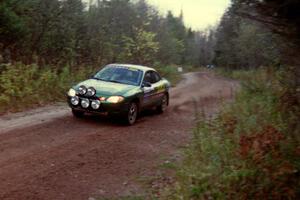 Tad Ohtake / Bob Martin at speed in their Ford Escort ZX2 on Menge Creek II.