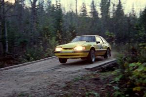 Don Rathgeber / Russ Rathgeber hop their Ford Mustang across the final bridge on Menge Creek II.