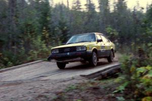 Mike Bodnar / D.J. Bodnar rockets across the final bridge of Menge Creek II in their Audi 4000S Quattro.