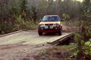 Doug Davenport / Al Kintigh drift their VW GTI across the final bridge of Menge Creek II.