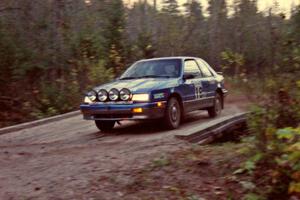 The Kendall Russell / Catherine Roso Dodge Shadow drives across the final bridge of Menge Creek II.