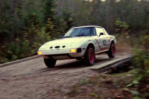 Craig Kazmierczak / Diane Sargent bring their Mazda RX-7 across the final bridge of Menge Creek II.