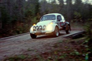 Mike Villemure / Reny Villemure drift their VW Beetle across the last bridge on Menge Creek II.