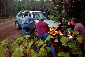 The Brett Corneliusen / Brenda Corneliusen VW GTI is pushed onto the road just just after the final bridge on Menge Creek II.