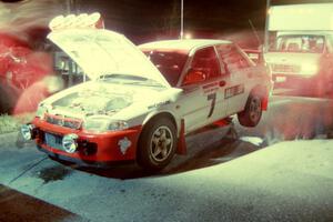 The crew of the TAD team go to work on the Henry Joy IV / Michael Fennell Mitsubishi Lancer Evo II at Kenton service.