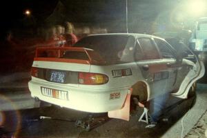 The crew of the TAD team go to work on the Henry Joy IV / Michael Fennell Mitsubishi Lancer Evo II at Kenton service.