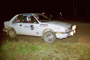 The Henry Krolikowski / Cindy Krolikowski Dodge Shadow sets up for a 90-right late at night.