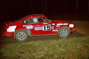 Mike Hurst / Rob Bohn set up for a 90-right at night in their Porsche 911.