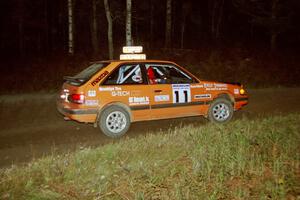 Gail Truess / Nancy Redner at speed through a 90-right at night in their Mazda 323GTX.