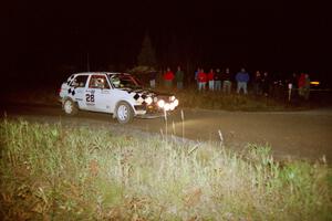 Richard Losee / Kent Livingston VW GTI at speed through a 90-right at night in their Mazda 323GTX.