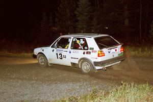 Wayne Prochaska / Annette Prochaska bring their VW Golf through a 90-right at night.