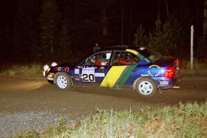 Al Kaumeheiwa / Craig Sobczak drift their Dodge Neon through a 90-right at night.