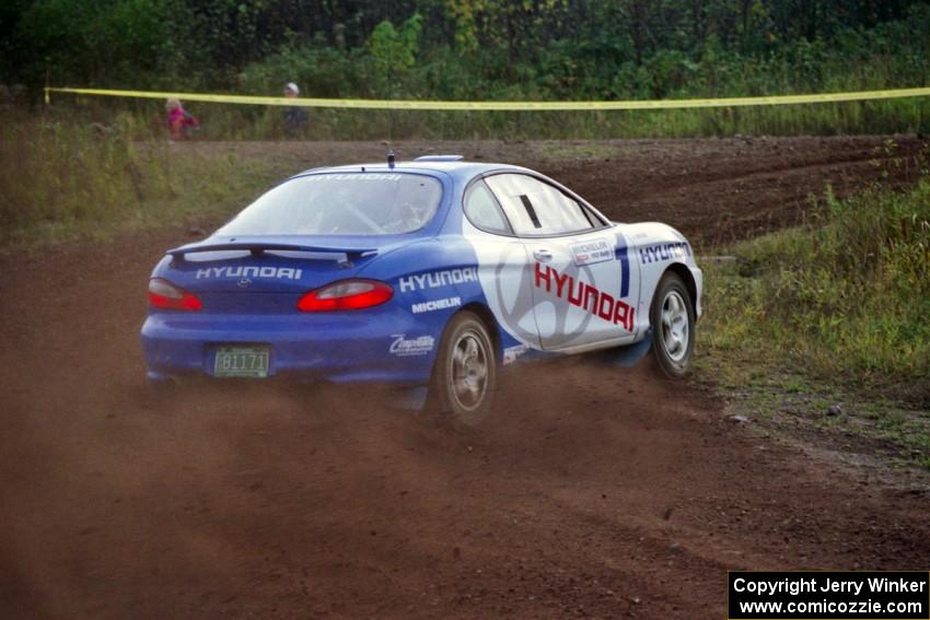 Paul Choiniere / Tom Grimshaw drift their Hyundai Tiburon hard at a right turn on the practice stage.