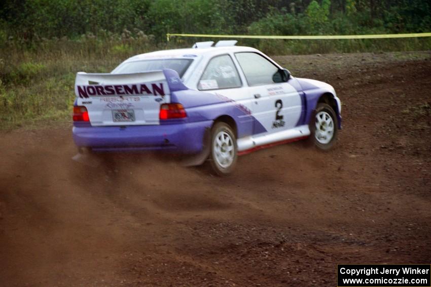 Carl Merrill / Lance Smith drift hard at a right turn on the practice stage in their Ford Escort Cosworth RS.