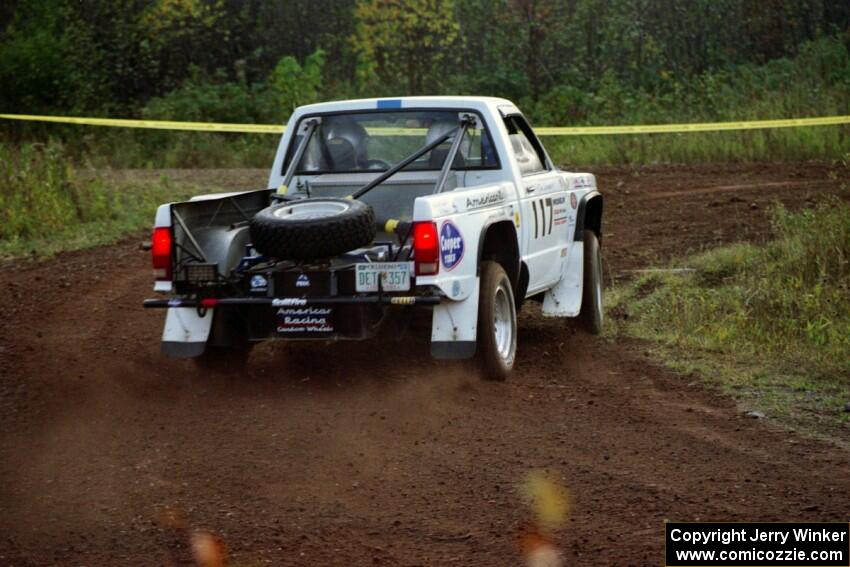 Ken Stewart / Doc Shrader drift their Chevy S-10 Pickup through a right turn on the practice stage.