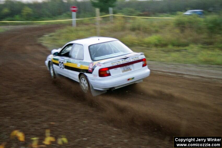 Tom Ottey / Pam McGarvey drift their Hyundai Elantra through a hard right on the practice stage.