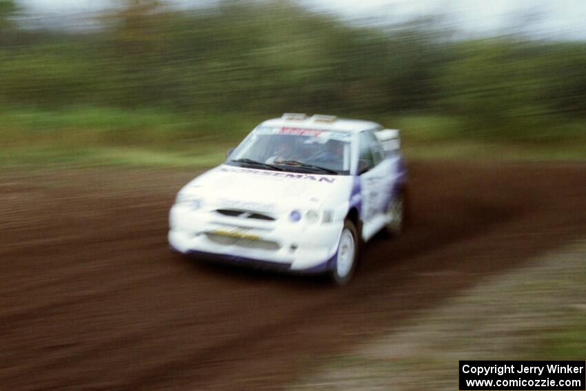 Carl Merrill / Lance Smith at speed on the practice stage in their Ford Escort Cosworth RS.