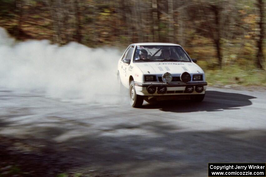 Henry Krolikowski / Cindy Krolikowski drift their Dodge Shadow huge on an early morning stage.