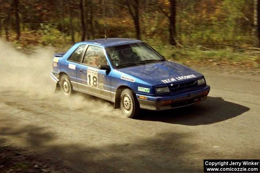 Kendall Russell / Catherine Roso drive their Dodge Shadow into the finish of SS2.