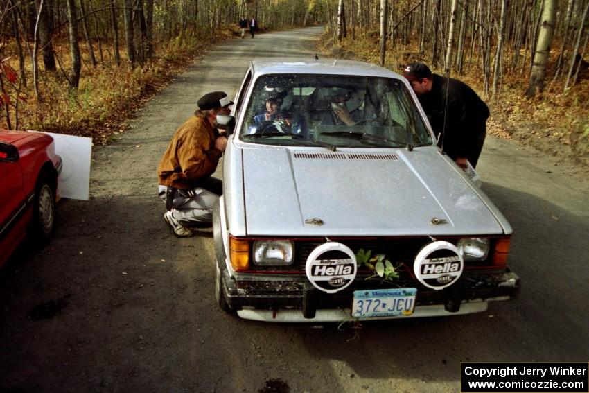 Brett Corneliusen / Brenda Corneliusen bring their VW GTI into the finish of SS2 sporting some leaves in the front grill.