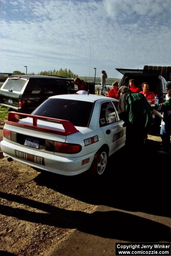 The Henry Joy IV / Michael Fennell Mitsubishi Lancer Evo II comes in for service.