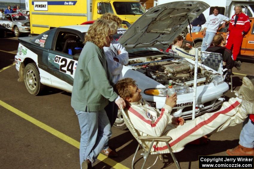 Bryan Pepp takes a breather with his wife at service in L'Anse. Dean Rushford was his co-driver for the event.