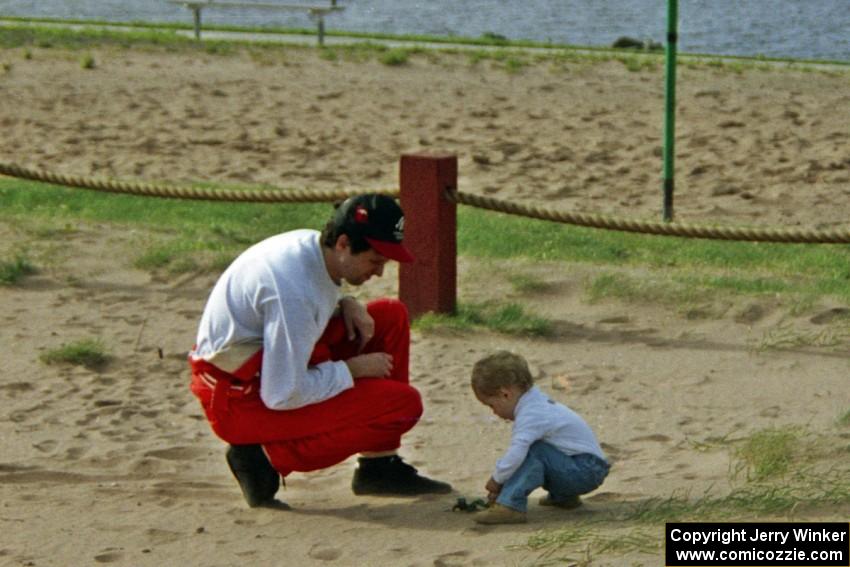 Henry Joy IV takes a break from the rally to play with his son, Henry Joy, while at service.