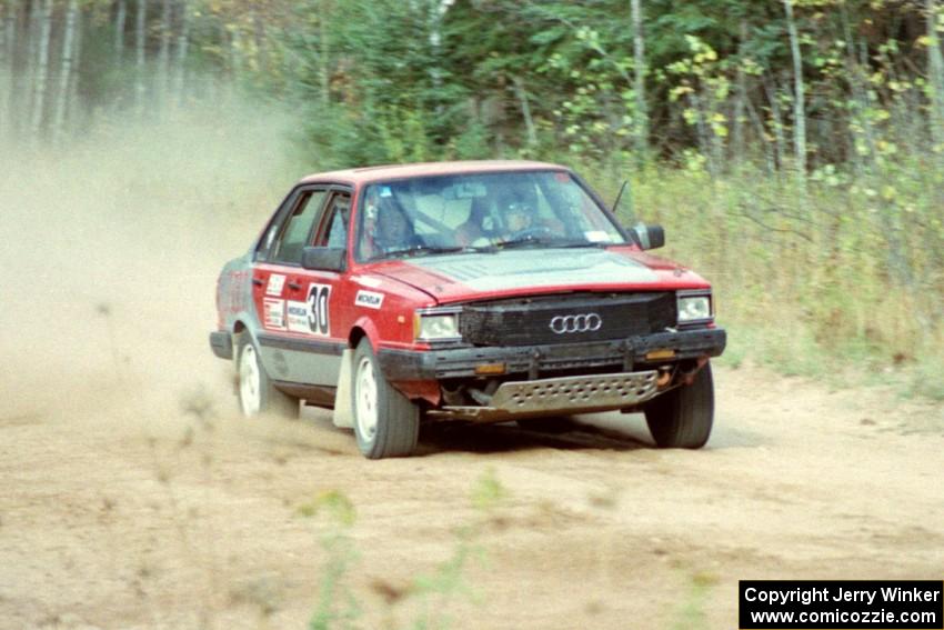 Jon Kemp / Gail McGuire at speed at the start off Menge Creek I in their Audi 4000 Quattro.