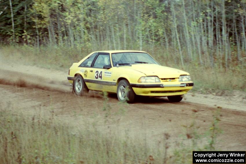 Don Rathgeber / Russ Rathgeber accelerate their Ford Mustang through the first sweeper of Menge Creek I.