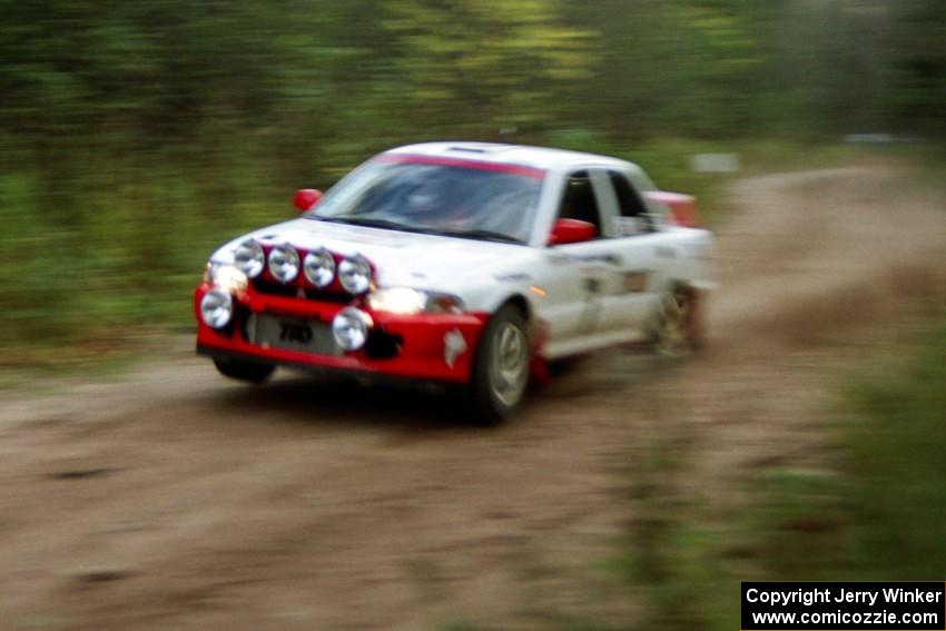 Henry Joy IV / Mike Fennell catch a little air over a culvert near the end of Menge Creek II in their Mitsubishi Lancer Evo II.