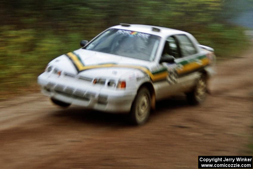 Tom Ottey / Pam McGarvey at speed on Menge Creek II in their Hyundai Elantra.