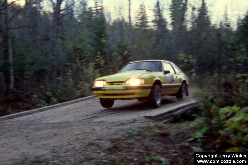 Don Rathgeber / Russ Rathgeber hop their Ford Mustang across the final bridge on Menge Creek II.