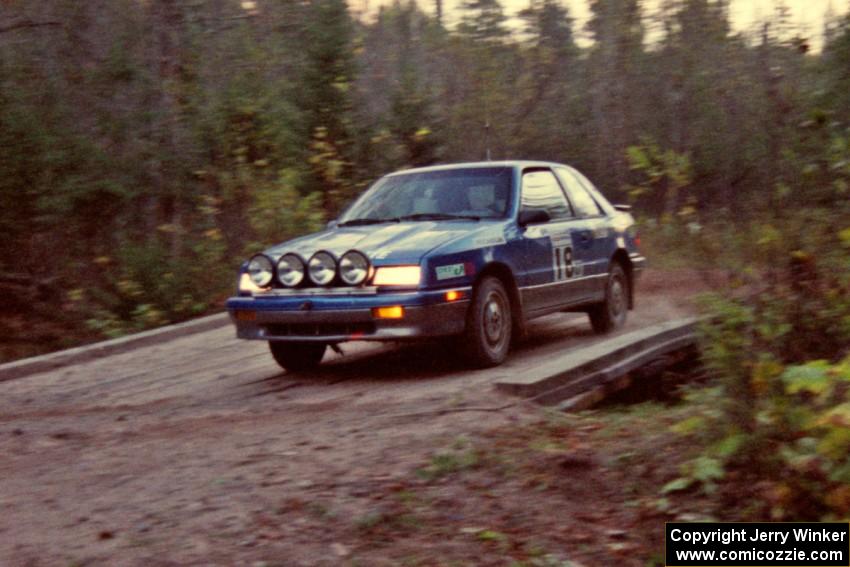 The Kendall Russell / Catherine Roso Dodge Shadow drives across the final bridge of Menge Creek II.