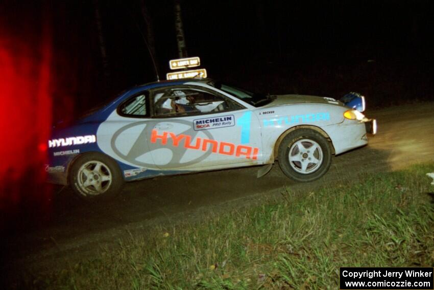 The Paul Choiniere / Tom Grimshaw Hyundai Tiburon sets up for a 90-right at night.