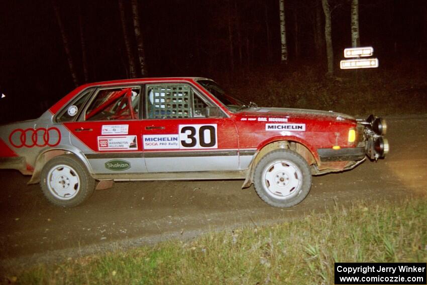 Jon Kemp / Gail McGuire through a 90-right at night in their Audi 4000 Quattro.