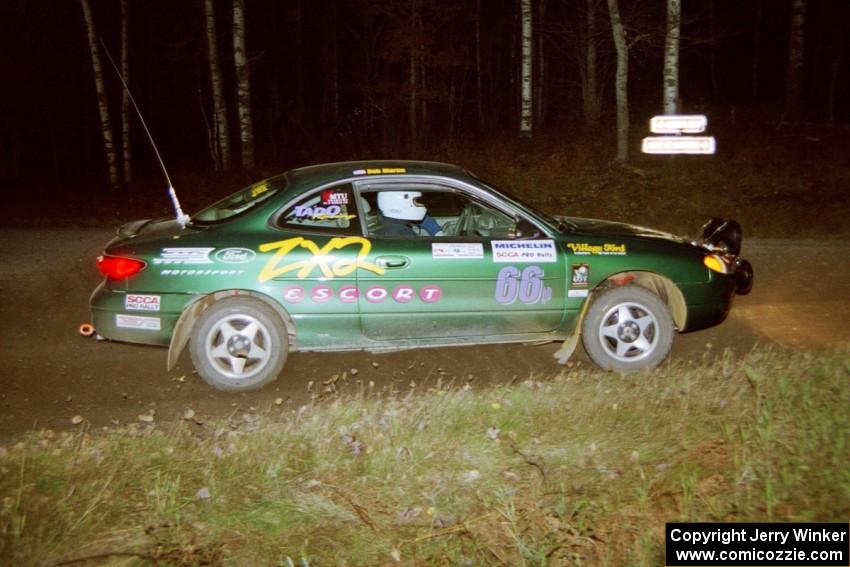 Tad Ohtake / Bob Martin set up for a 90-right at night in their Ford Escort ZX2.