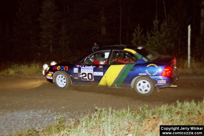 Al Kaumeheiwa / Craig Sobczak drift their Dodge Neon through a 90-right at night.