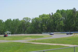 Chump Faces BMW 325is passes the stalled Team HACKcent Hyundai Accent at the carousel