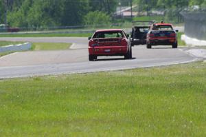 Brake Dusters BMW 540 leads Tubby Butterman BMW 325 and Trump Chump Honda Prelude out of turn 6