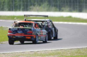 Brake Dusters BMW 540 leads Tubby Butterman BMW 325 through turn 6