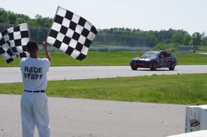 Tubby Butterman BMW 325 takes the checkered flag