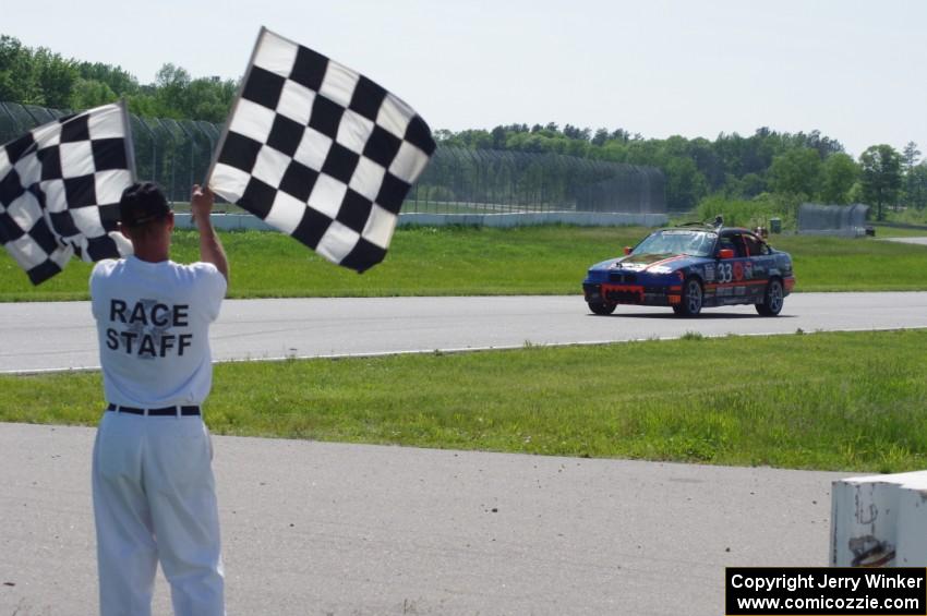 Tubby Butterman BMW 325 takes the checkered flag
