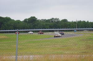 Five cars head out of turn 4 into turn 5