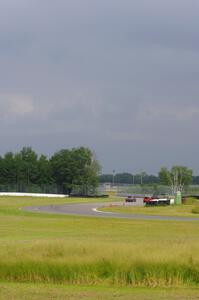 Hazy skies as three cars exit the carousel